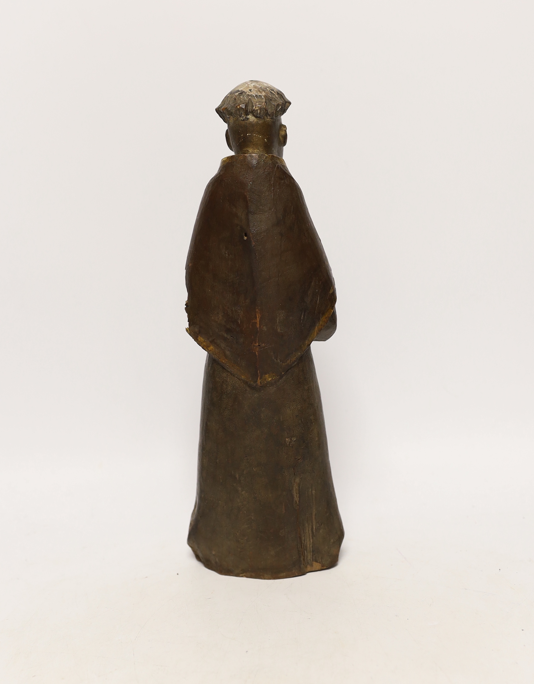 A late 19th/early 20th century polychrome carved wood religious figure, 32cm
